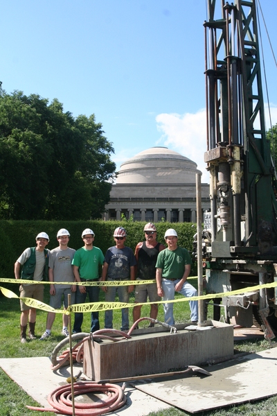 From left to right, Peter Flemings, Mark Andrews and Kristopher Darnell of the University of Texas at Austin; Stephen Ramsdell and Orrin Cone, drillers with New England Boring; and John Germaine pose on Killian Court with a drilling rig that helped the researchers gather data on an experimental probe that measures soil pore pressure.