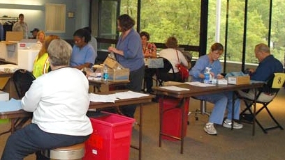 MIT Medical staff members administer flu shots on the third floor of the Student Center.