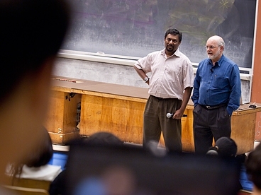 Computer science professors Saman Amarasinghe, left, and Charles Leiserson co-teach a class called Performance Engineering of Software Systems, where students' code is reviewed by volunteer Boston-area programmers.