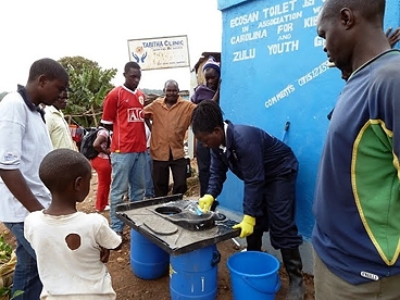 Community members attend a training session to learn how to keep the new Sanergy pilot toilets spotlessly clean.