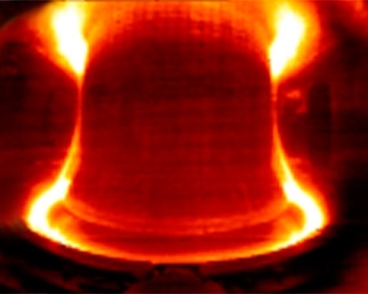 Photo of the interior of Alcator C-Mod during a test run shows the glowing hot plasma, which can reach more than 55 million degrees Celsius.
