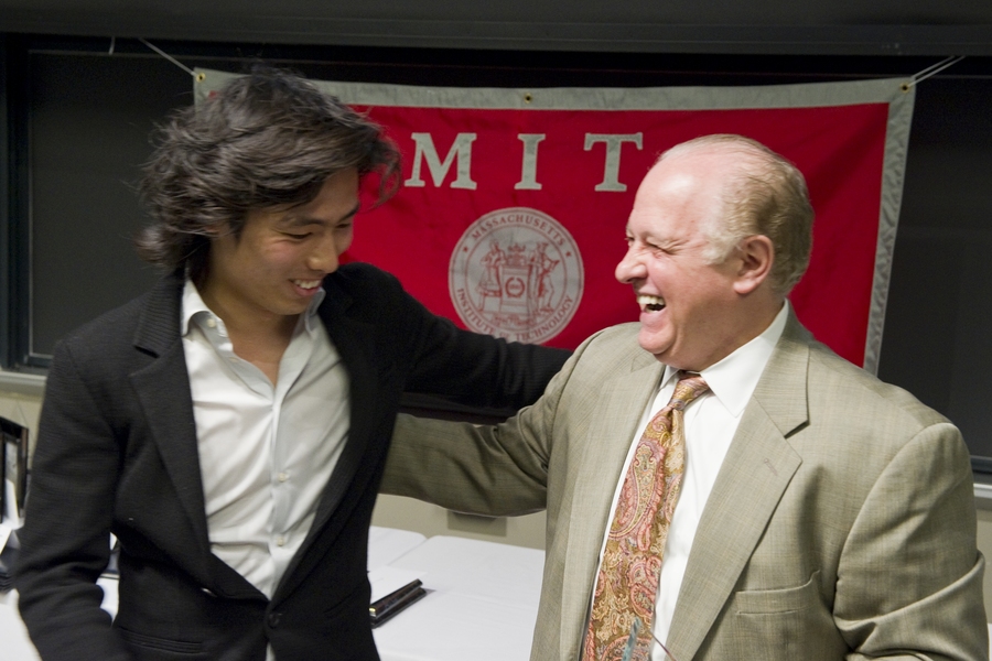 Dean for Student Life Chris Colombo presents the 2010 William L. Stewart Award to graduate student Alex Hamilton Chan.