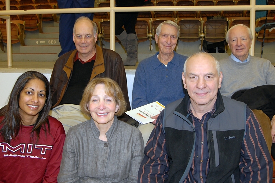 Alumni and staff also came to cheer on the men. Back row, from left: Ross Hunter ’69, former player and first MIT women’s basketball coach; Ted Heuchling ’46, former captain and head coach; and Mike Nacey ’52, former player and captain. Front row, left to right: Sonia Raman, MIT women’s basketball head coach; Deena Ferrara; and Robert Ferrara, ‘67, former player.