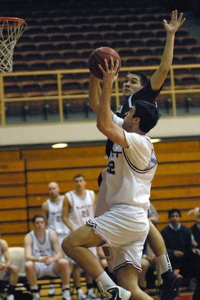 Freshman Tim Donegan takes the ball to the hoop on a breakaway against Springfield College in the first round of the tournament.