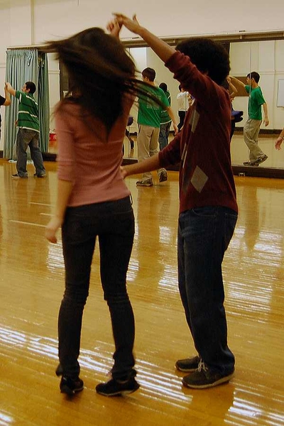 Students twirl their partners during the salsa dance course.