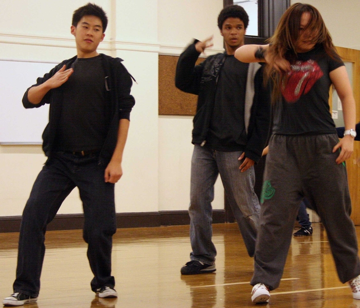 A few students improvise and show off their moves in the hip-hop class.