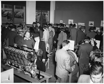 During the 1948 MIT Open House, visitors examine engines.