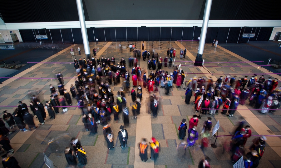 Members of the procession gather in the main lobby prior to the start of the event.