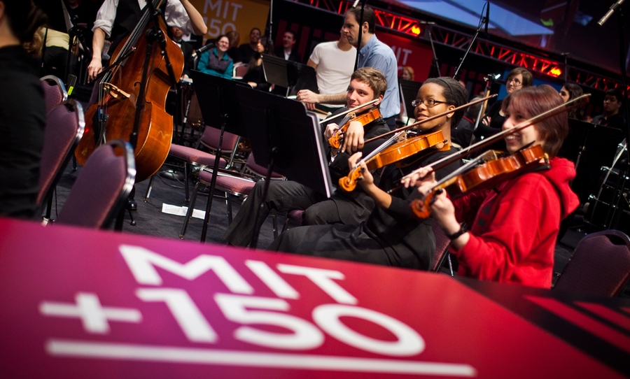 The event included several musical selections. Here, the MIT Symphony Orchestra rehearses for its performance.