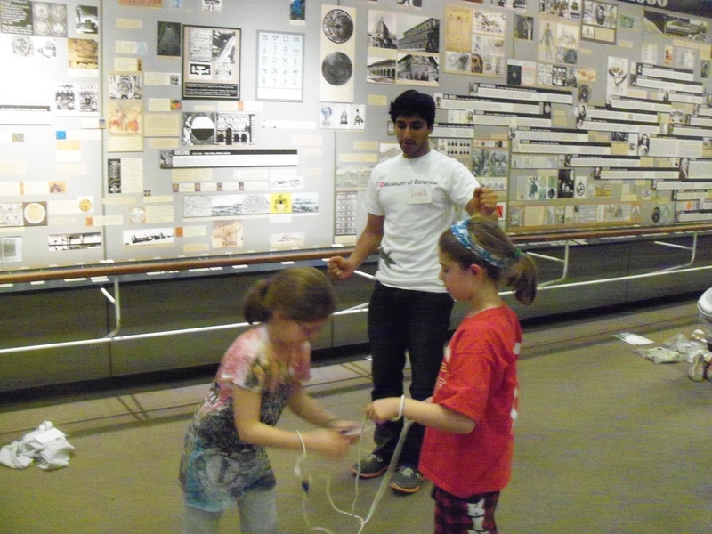 Vivek Desari teaches about knots in the Mathematica exhibit at an Overnight with the Boston Museum of Science.