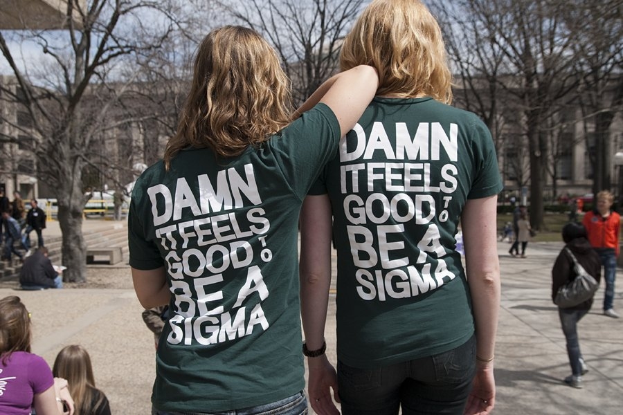 Two sisters from the Sigma Kappa sorority show their pride on the steps of the Student Center.