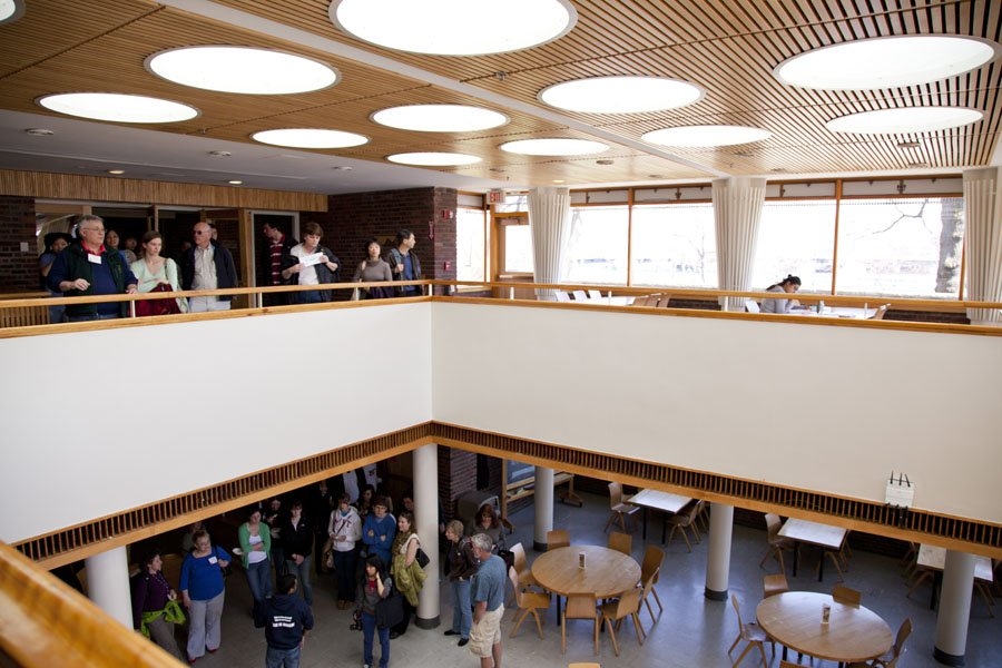 A tour group passes through the Baker House dining hall. All of the undergraduate dorms threw their doors open to prefrosh and parents for regular tours throughout the weekend.