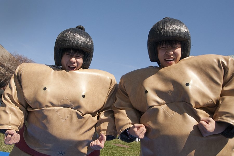 Prospective students Xiao Zhu, left, and James Jiang, right, prepare to fight it out sumo-style at the IFC Carnival on Saturday.