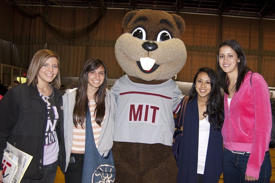 Who could choose another school after meeting Tim the Beaver? Prospective students Rachael Aptowitz, Elena Gianotas, Ashley Peter and Michelle Battipaglia say hi to Tim in the Rockwell Cage.