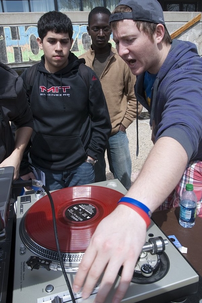 Sophomore Richard Wood, right, teaches how to DJ to prospective students Willy Vasquez, left, and Peter Brobbey, center, on the steps of the Student Center.