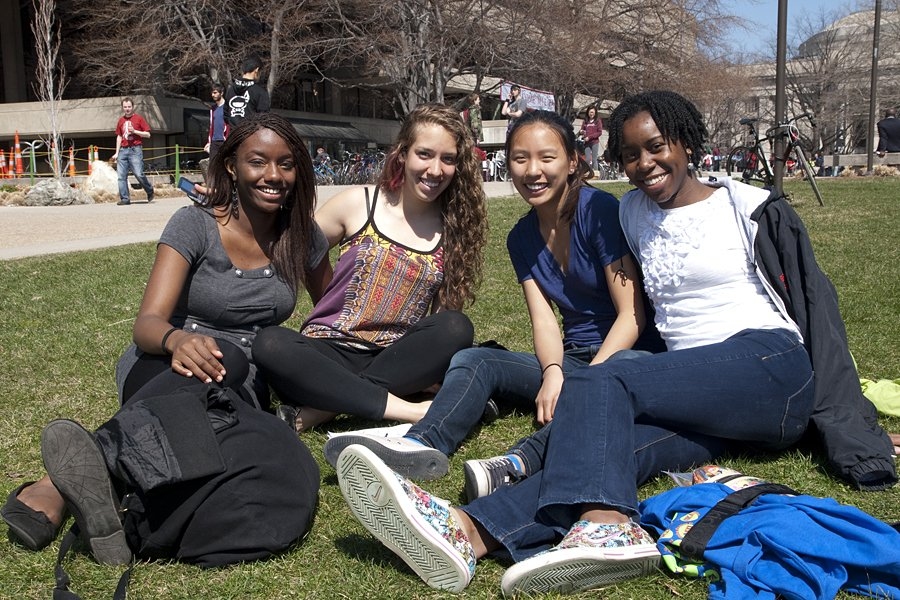 Prospective students, from left to right, Alexis Wilkinson, Aileen Lerch, Hannah Ho and Sarah McMillian get to know one another on the lawn next to Kresge Auditorium on Saturday.