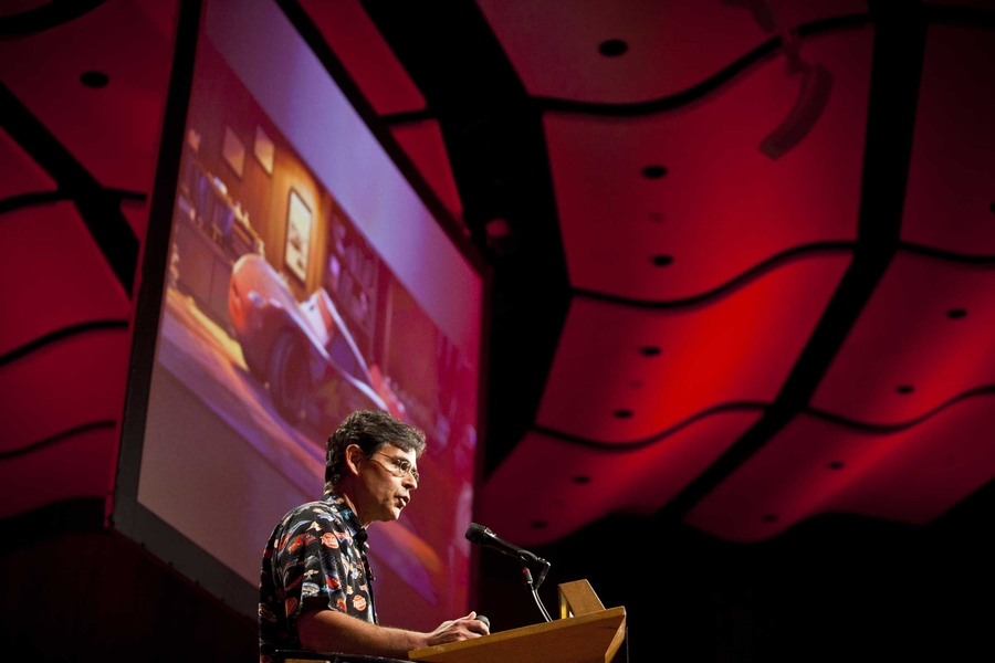 Tony DeRose, who leads the research group at Pixar Animation Studios, with a still from the Pixar movie Cars.