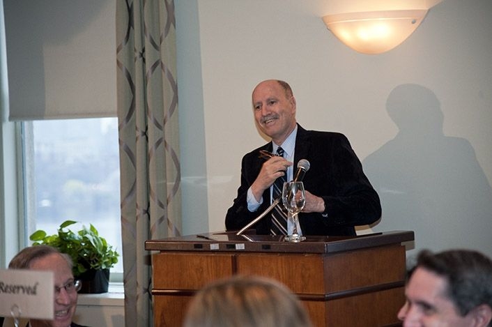 Yossi Sheffi, director of the MIT Engineering Systems Division, welcomes guests at a dinner at the MIT Faculty Club in honor of Roos.