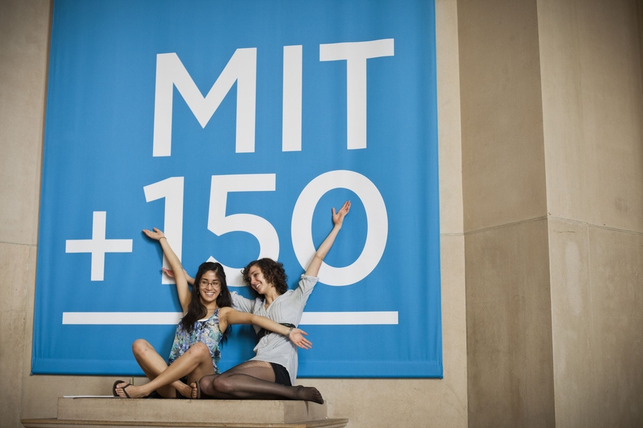 Two students taking part in the flash mob perform on the plinths in Lobby 7.
