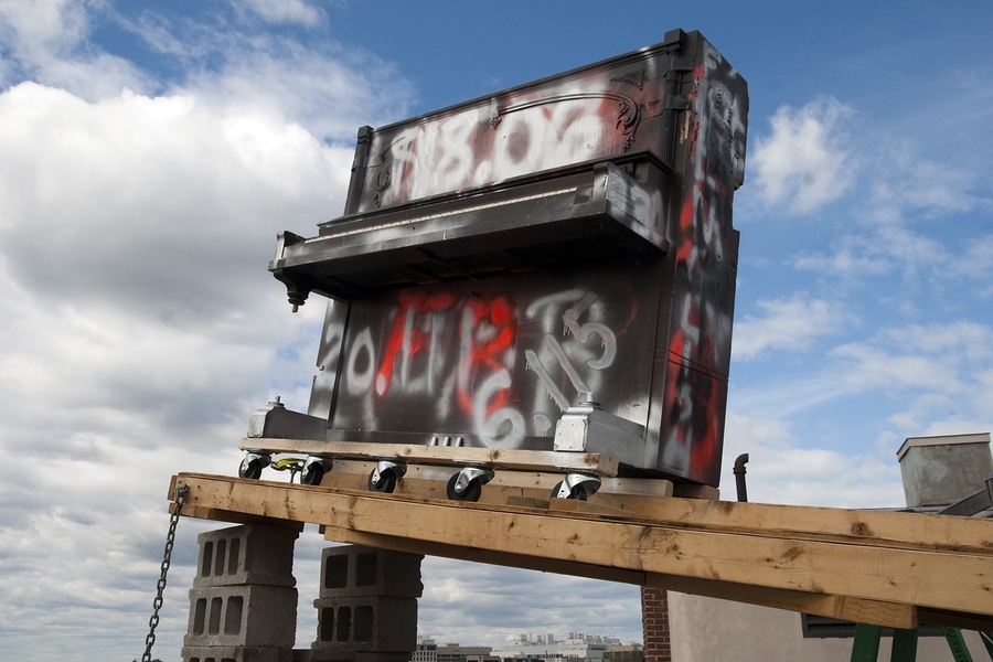 An old piano on the roof of Baker House awaits its launch at the dormitory's annual piano drop. In a tradition dating back to the early 1970s, Baker's residents drop a piano from the six-story building to commemorate the last day to drop classes.