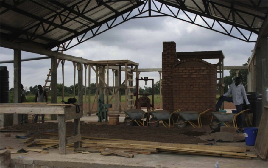The factory under construction last summer. At center is the kiln, which will be used to bake both the ceramic pots and the bricks.