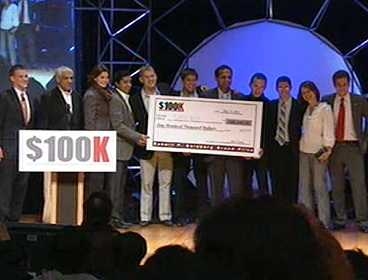 Members of sanitation start-up 'Sanergy' accepts the $100,000 prize as winners of the MIT $100K competition 100K associate director John Casey (far left), managing director Kourosh Kaghazian (far right), and venture capitalist Vinod Khosla (second from left) presented the team with the check.