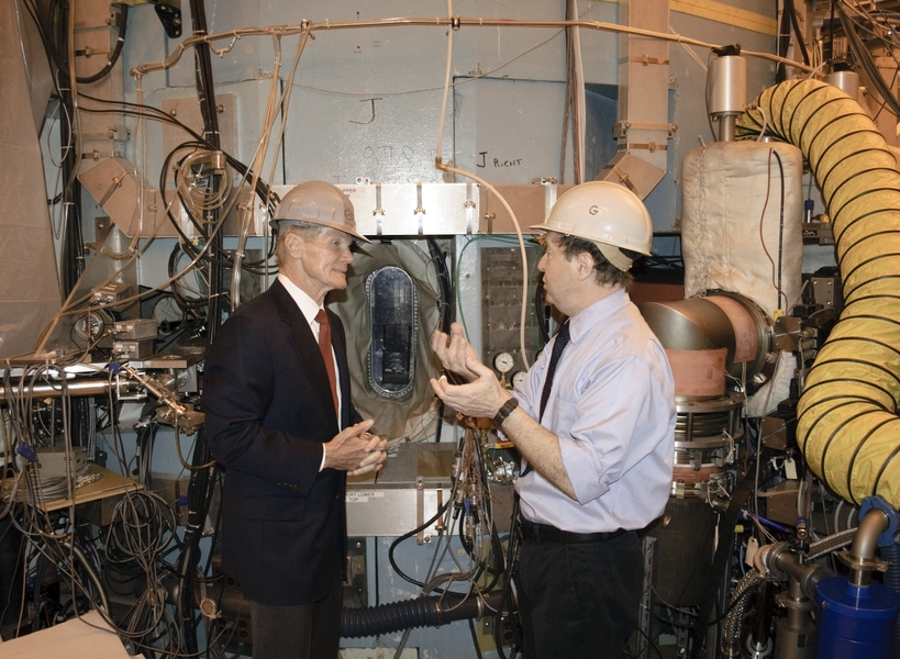 Senior Research Scientist Martin Greenwald (right) discusses the importance of fusion research with Florida Sen. Bill Nelson in front of a port in the Alcator C-Mod tokamak.