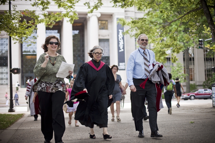 Chancellor Eric Grimson, right, and Dean of the School of Architecture and Planning Adèle Naudé Santos walk across 77 Massachusetts Avenue toward the hooding ceremony.