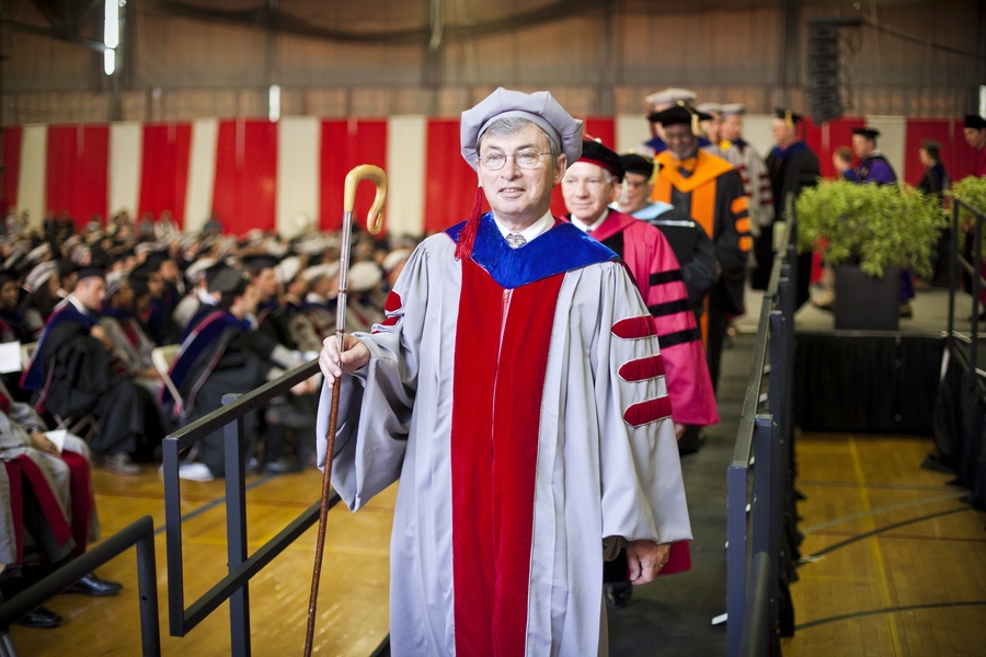Thomas A. Kochan, chair of the MIT faculty, leads faculty members down a ramp at the ceremony.