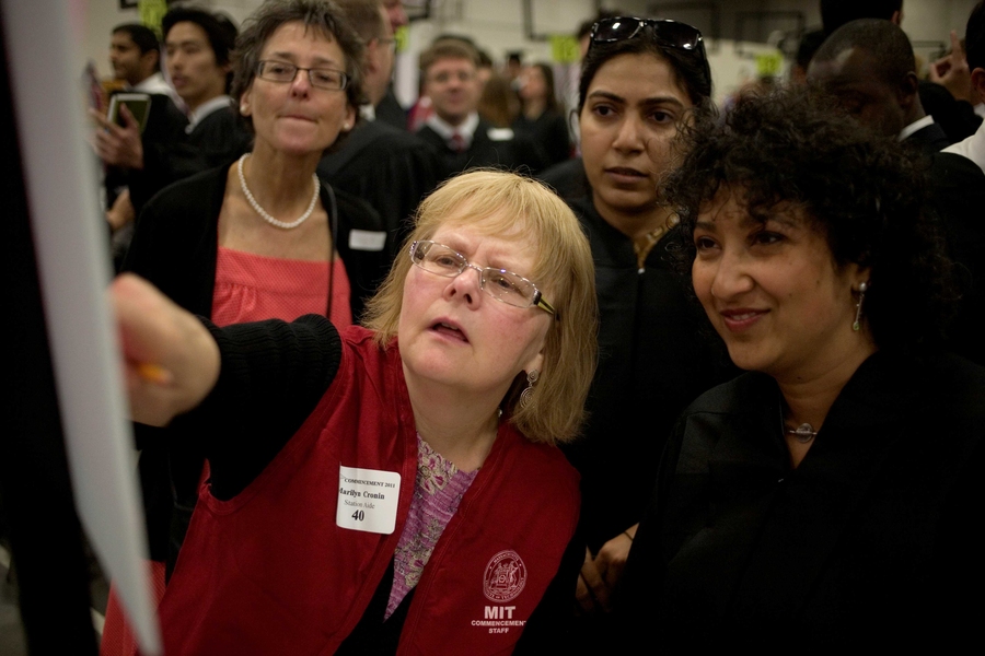 A Commencement volunteer helps friends and family of the graduates find their way around on Commencement Day.