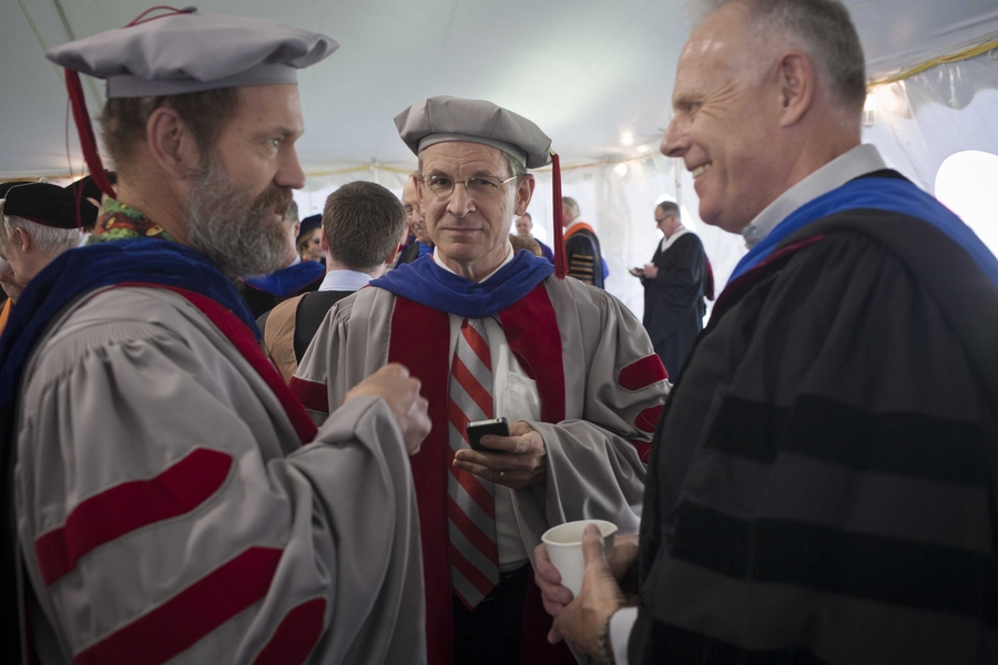 Faculty chat prior to the procession ceremony.
