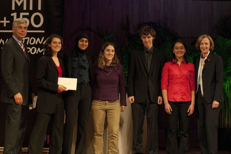 Practical Energy Network accepts MIT Global Challenge award, sponsored by the School of Engineering's "Global Villages" Challenge. From left to right: Dr. Thomas Byrne, Anna Waldman-Brown, Fareeha Safir, Brianna Conrad, Edward Burnell, Heather Beem, and President Susan Hockfield.