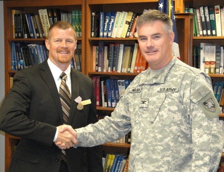 Colonel Ray Nelson, U.S. Army, (right) acting head of the Department of Physics and Nuclear Engineering at the U.S. Military Academy at West Point, presented Kenneth Chadwick with the Army's Outstanding Civilian Service Medal at a ceremony held this past June.