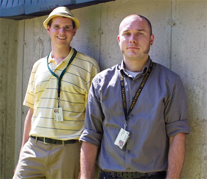 Lincoln Laboratory researchers Gregory Charvat, background, and John Peabody, foreground, stand before the solid concrete wall through which they successfully detected and captured human movement.