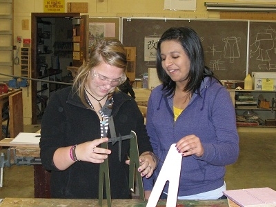 Two InvenTeams students developing their invention prototype.