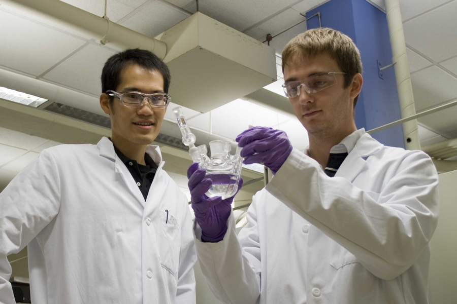 Materials Science and Engineering Graduate Student Jin Suntivich (left) and Mechanical Engineering Graduate Student Kevin J. May (right) inspecting the electrochemical cell for oxygen evolution reaction experiment.