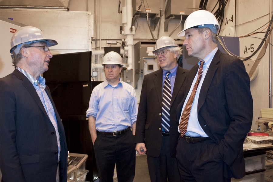 U.S. Sen. Sheldon Whitehouse of Rhode Island (right), accompanied (right to left) by MIT alumnus Reinier Beeuwkes and PSFC Associate Director Martin Greenwald, listens to Alcator C-Mod Project Head Earl Marmar discuss the importance of fusion research at MIT.