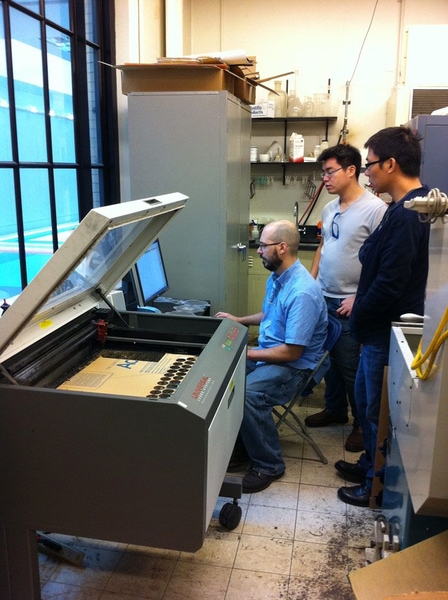 Mike Tarkanian, technical instructor for MIT’s department of materials science and engineering, demonstrated the power of a laser cutter for Shauhui and Jun. The laser cutter, the SUTD faculty learned, produces a fire-polished edge, as opposed to a less precise water jet.