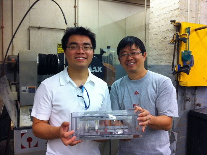 Shaohui shows off his portable water filtration system with fellow SUTD Assistant Professor Jean Yong. Yong plans to bring the system to Indonesia where individual households will use it to filter bacteria and other contaminants from their drinking water.