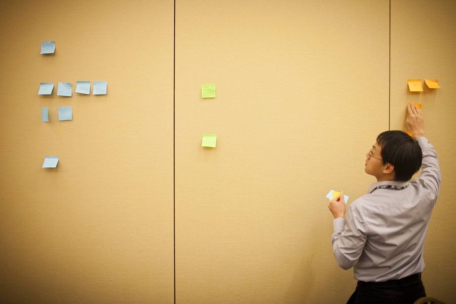 Ideas are posted during a group discussion of manufacturing.