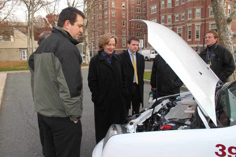 MIT President Susan Hockfield and Executive Vice President and Treasurer Israel Ruiz check out under the hood of the new 2011 Ford Transit electric vehicle. The motor is electrically powered and contains a liquid cooled 28 kWh lithium-ion battery pack with internal sensors and controller.