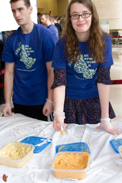 Senior Molly Kozminsky shows off the winner of the fifth annual MIT Hummus Taste Off: "Messrs Bentry and Lolpert’s Silk Road Hipster Hummus with Grapefruit Black Tea Infusion."