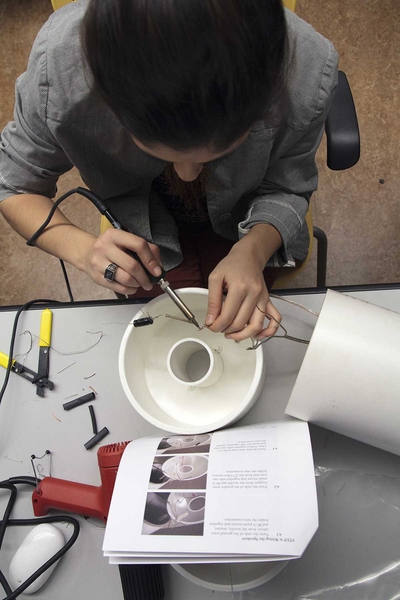 Junior Vanessa Trevino solders the crossover components of the two-way speaker system by following the step-by-step instructions created by the Bose engineers.