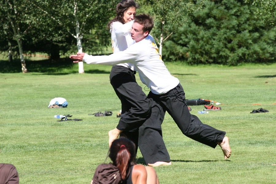 EMBA student Jennifer Jordan defends herself with a basic Cun Tao (self-defense) move on one of her students.