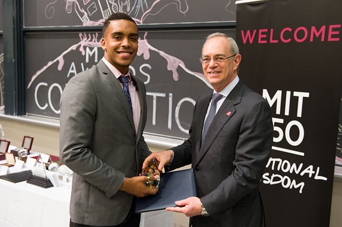 Provost Reif presents the Laya & Jerome B. Wiesner Student Art Award to Dorian Dargan '11.