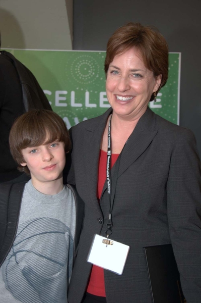 Sharon Bridburg (right), 2012 MIT Excellence Award recipient, is joined by her son, at the reception following the ceremony.