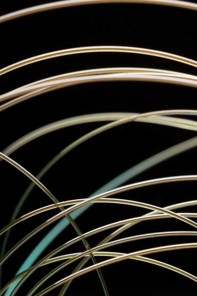 A new fiber developed by Yoel Fink's group emits blue laser light only at a precisely controlled location.