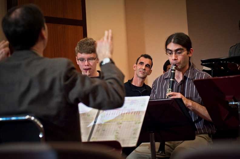 Frederick Harris, Jr., music director of the MIT Wind Ensemble, members of the MIT Wind Ensemble and visiting artist Jamshied Sharifi