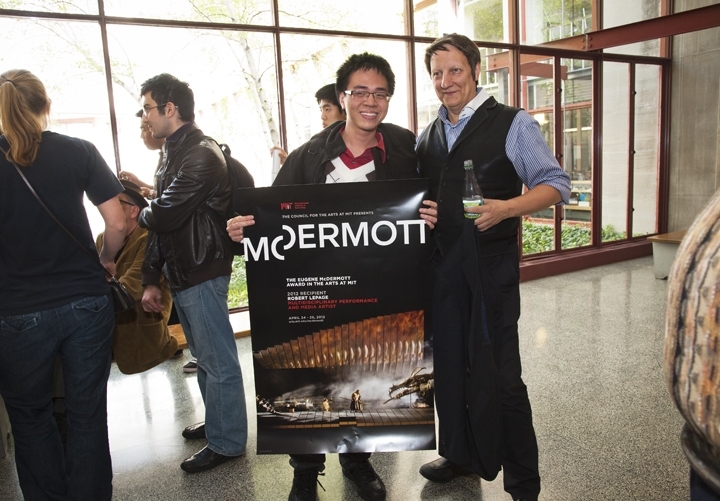 Robert Lepage with a student after the Q&A session