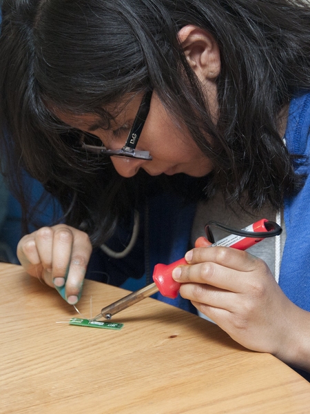 Prospective freshman Xitlali Juarez learns how to make electronics at &#39;Next Make,&#39; a student-led hands-on engineering event at Next House, one of MIT&#39;s undergraduate dormitories.